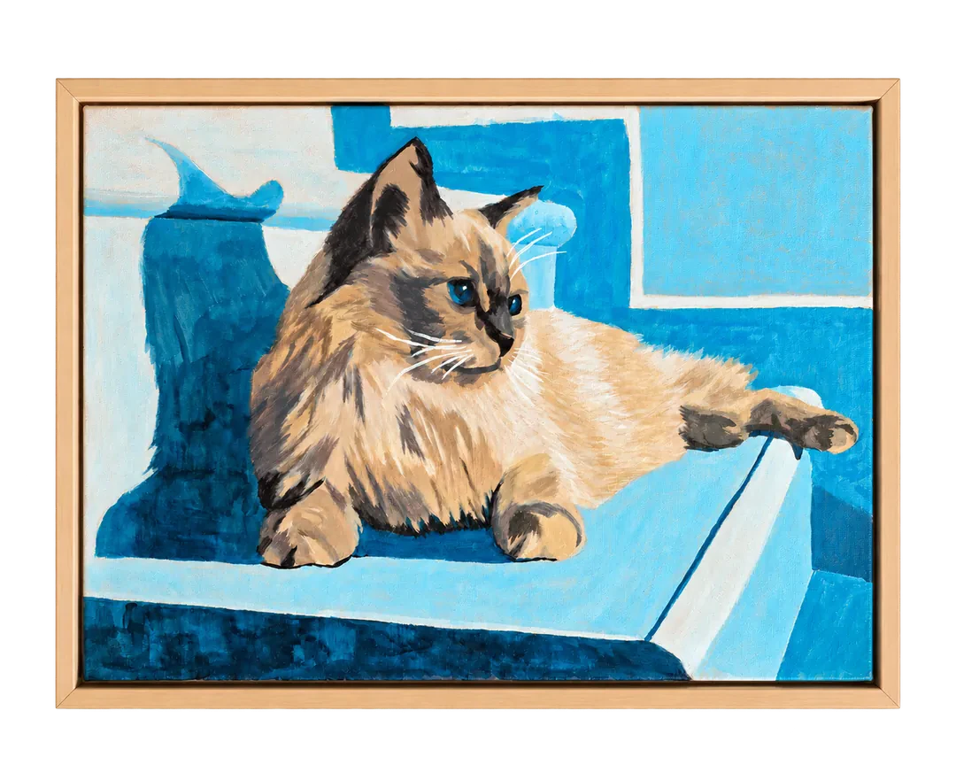 Framed blue acrylic painting of a reclining cat